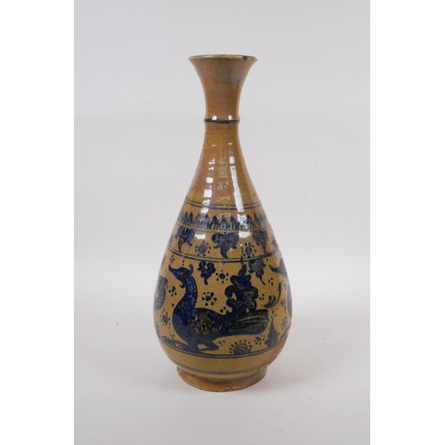 350 - A C19th oriental blue and white pottery pear shaped vase decorated with ducks and fish, 34cm high