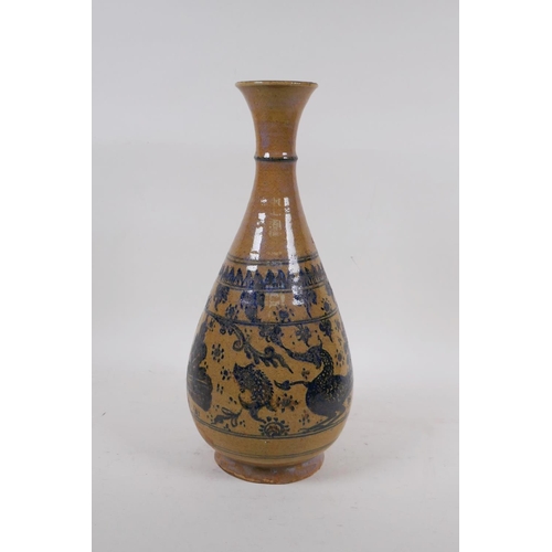 350 - A C19th oriental blue and white pottery pear shaped vase decorated with ducks and fish, 34cm high