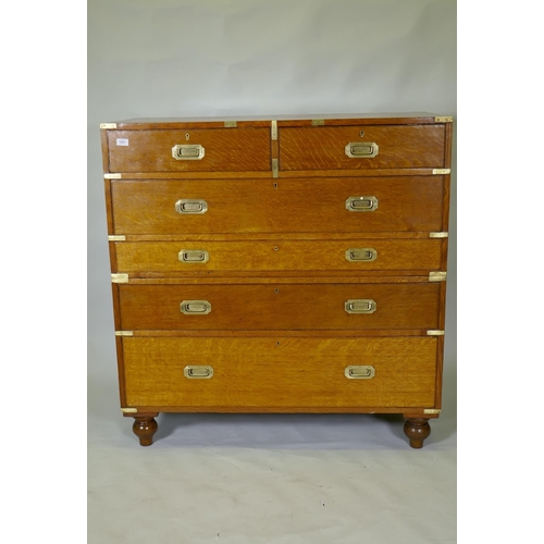 1001 - A fine late C19th/early C20th golden oak secretaire campaign style chest of two sections, the upper ... 