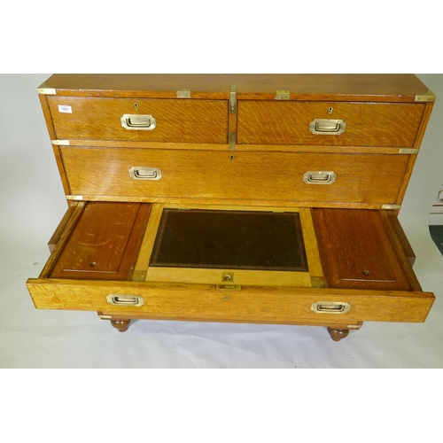 1001 - A fine late C19th/early C20th golden oak secretaire campaign style chest of two sections, the upper ... 