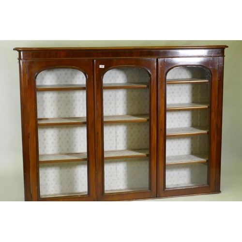 1008 - A Victorian mahogany bookcase top with three glazed arched doors, 183 x 32 x 134cm