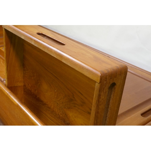 1011 - A mid century/1970s teak Danish style sideboard with four drawers over four cupboards and glazed upp... 