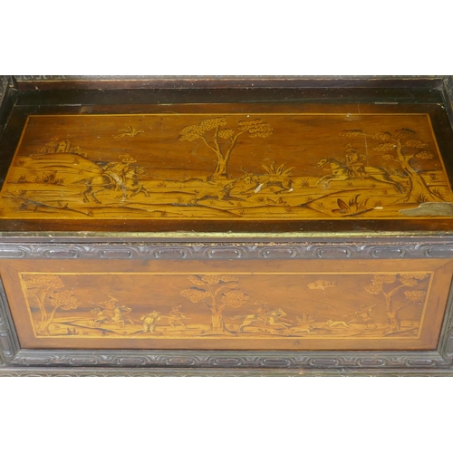 1021 - An early C19th Continental marquetry inlaid settle, the seat back and front panel decorated with hun... 