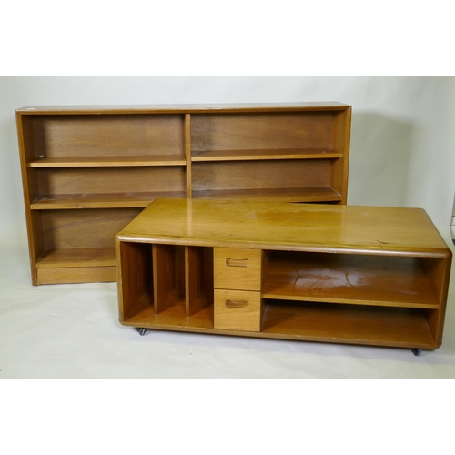 1029 - A mid century walnut bookcase with sliding glass doors, 153 x 25 x 84cm, and a teak media unit