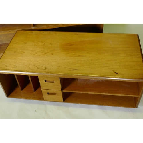 1029 - A mid century walnut bookcase with sliding glass doors, 153 x 25 x 84cm, and a teak media unit