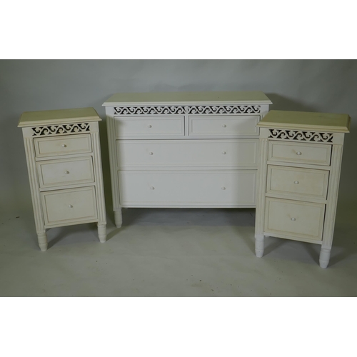 1031 - A painted bedroom suite, two three drawer bedside cupboards, 17cm high, and a chest of drawers, 90 x... 