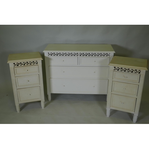 1031 - A painted bedroom suite, two three drawer bedside cupboards, 17cm high, and a chest of drawers, 90 x... 