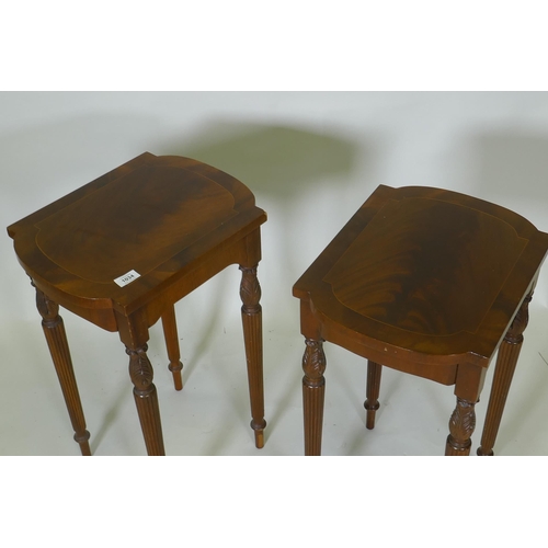 1034 - A pair of inlaid mahogany end tables, with shaped tops, raised on fluted tapering supports, 32 x 49 ... 