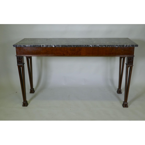 1038 - A mahogany Chippendale style serving table, with marble top and blind frieze, raised on pierced tape... 