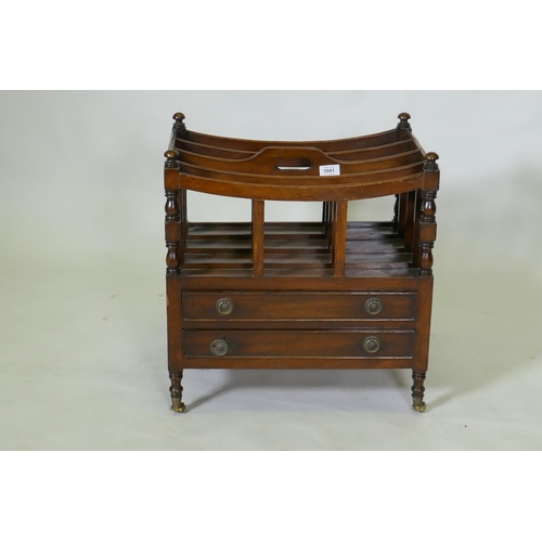 1041 - A C19th mahogany canterbury with two drawers, raised on turned supports with brass castors, 49 x 35 ... 