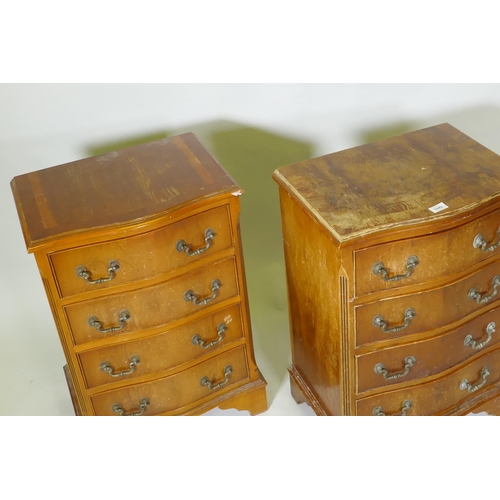 1042 - A pair of serpentine front yew wood veneered bedside chests of four drawers with brass handles, rais... 