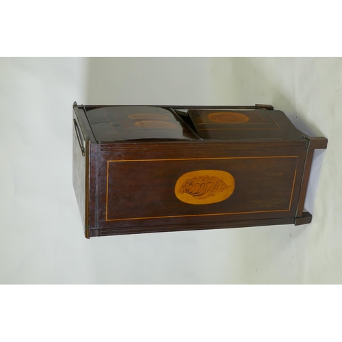 1043 - A C19th Continental mahogany four door cabinet with shell inlaid panels raised on block supports, 54... 