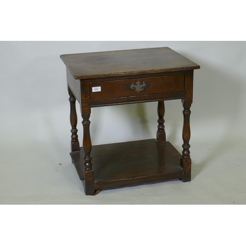 1051 - Antique style oak two tier single drawer side table, raised on baluster shaped supports, 48 x 60 x 6... 