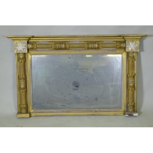 1063 - A Regency giltwood and composition over mantel mirror with anthemion decoration and original glass p... 