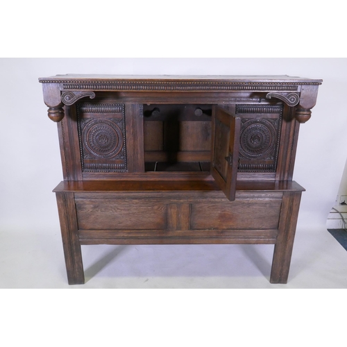 1067 - Late C18th/early C19th French oak side/food cupboard, with triple panel front and single door, carve... 