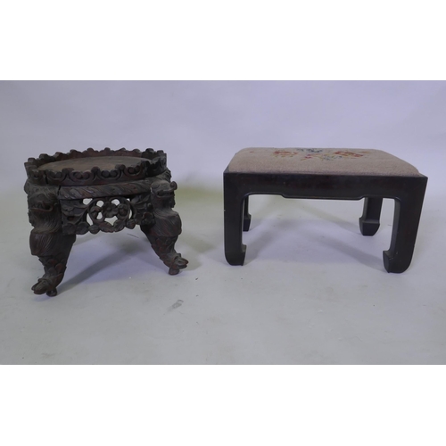 1069 - A C19th oriental hardwood stand, with carved and pierced frieze, raised on dragon supports, possibly... 