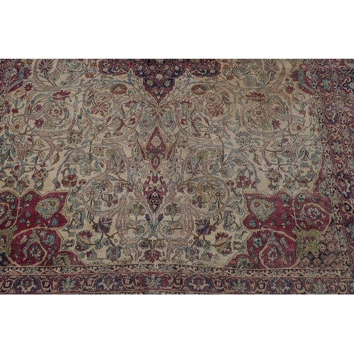 1071 - An antique Persian carpet, medallion design on a red field, pile worn/20cm tear, 270 x 362cm