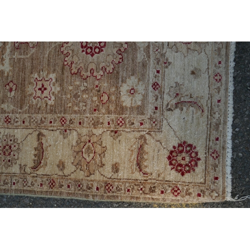 1074 - A cream ground wool Ziegler Mahal runner decorated with floral medallions, 85 x 350cm