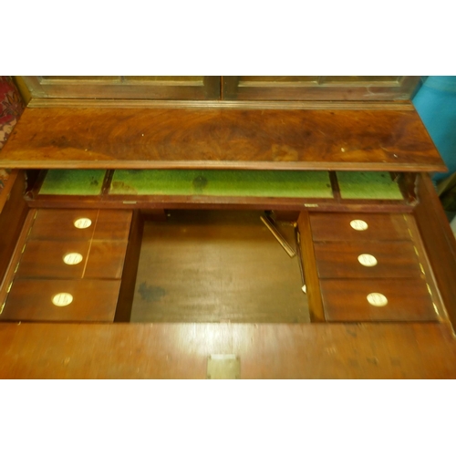 1086 - A Regency mahogany secretaire bookcase/estate cabinet, the upper section with two astragal glazed do... 