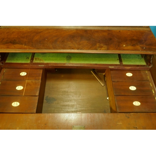 1086 - A Regency mahogany secretaire bookcase/estate cabinet, the upper section with two astragal glazed do... 