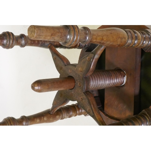 1089 - An early C19th mahogany revolving piano stool, 50cm high