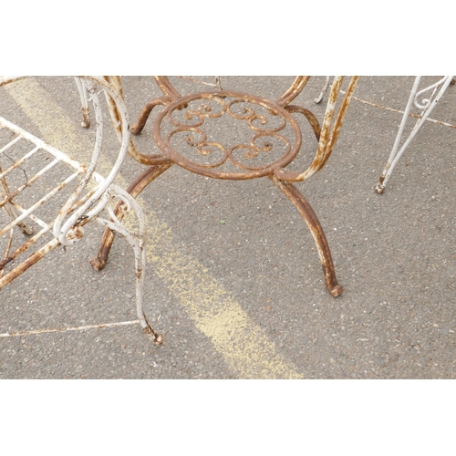 1092 - A vintage French wrought iron garden/bistro table and four chairs, early/mid C20th, table 87cm diame... 