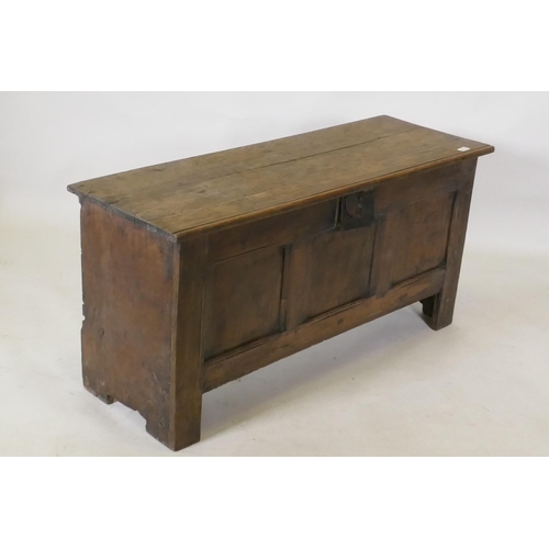 1111 - Early C18th oak triple panel oak coffer, with planked top and ends, raised on stile supports, 112 x ... 