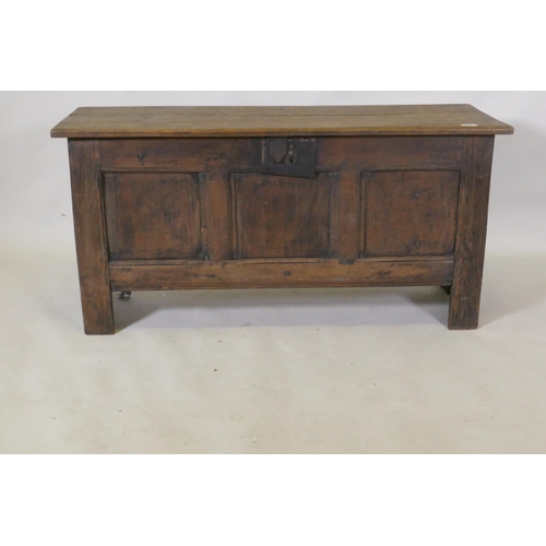 1111 - Early C18th oak triple panel oak coffer, with planked top and ends, raised on stile supports, 112 x ... 