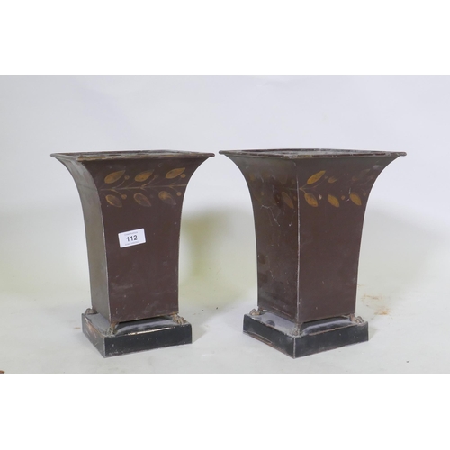 112 - A pair of painted toleware vases raised on paw feet, 29cm high