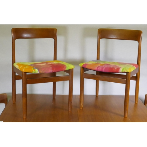 1128 - A mid century teak extending dining table, with folding leaf, designed by John Herbert for A. Younge... 