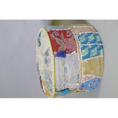 1134 - A North African leather patchwork pouffe, 60cm diameter x 35cm high, and another with Indian embroid... 