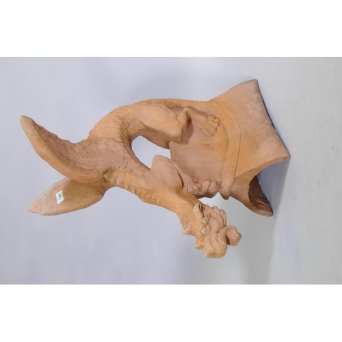 1148 - A terracotta ridge tile in the form of a winged dragon, 68cm high