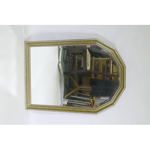 1152 - An over mantel bevelled glass mirror, 71 x 101cm