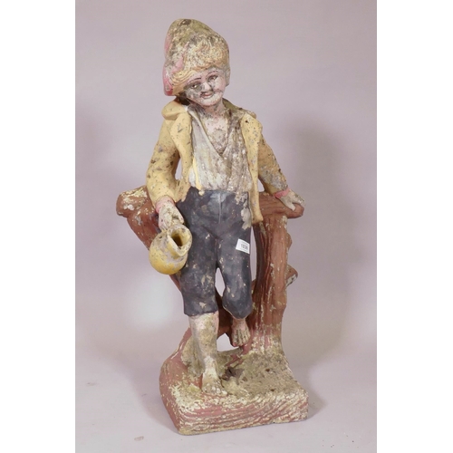 1158 - A painted concrete garden figure of a young boy leaning on a tree stump, 80cm high