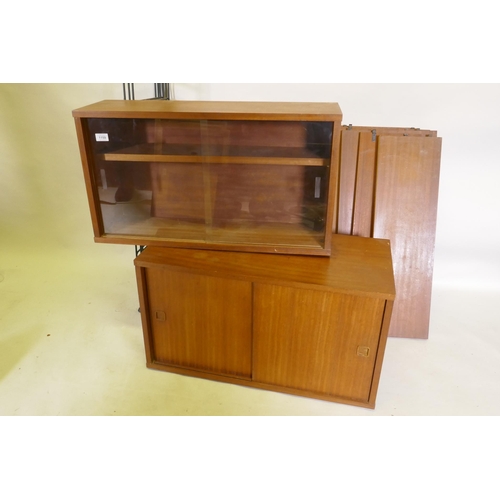 1159 - A mid century mahogany Ladderax style wall system of two cabinets and shelves, 178cm high