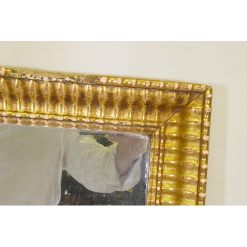 1160 - A C19th French watergilt trumeau mirror with textile panel, 138 x 73cm 