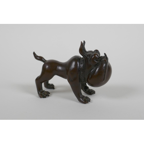 120 - An oriental bronze caricature bulldog, mark to base, 8cm long