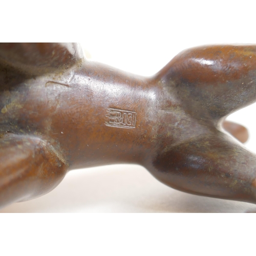 120 - An oriental bronze caricature bulldog, mark to base, 8cm long