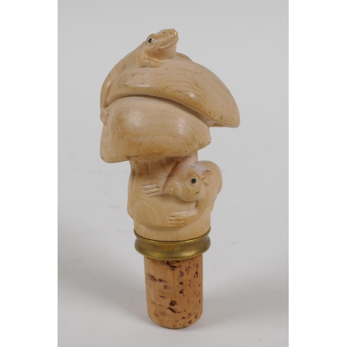 122 - A carved boxwood bottle stopper in the form of mushrooms, toad and rat, 10cm