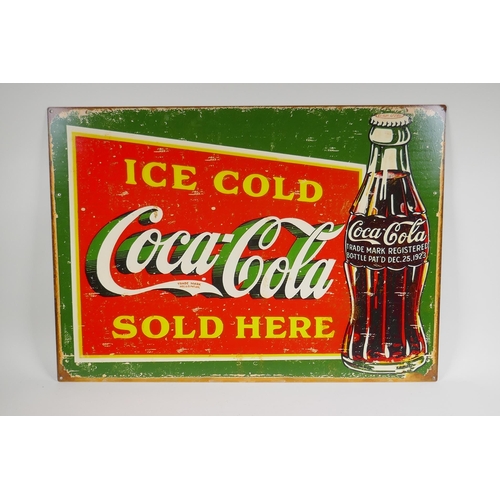 129 - A vintage style metal 'Coca-Cola' advertising sign, 70 x 50cm