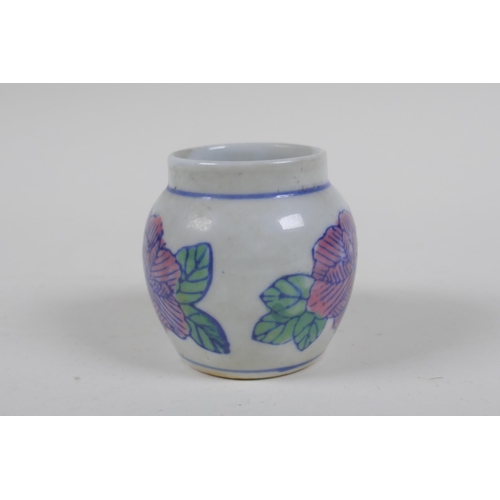 133 - A Chinese porcelain bird feeder with floral decoration, 2 character mark to handle, 7cm high