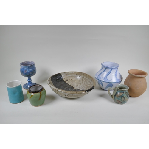 134 - A quantity of assorted studio pottery, to include bowls, jugs, vases and goblets, largest 30cm diame... 