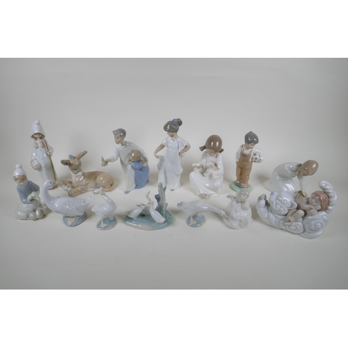 139 - A collection of fourteen Lladro and Nao figurines and animals, largest 22cm high