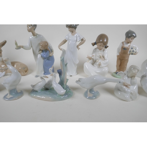 139 - A collection of fourteen Lladro and Nao figurines and animals, largest 22cm high