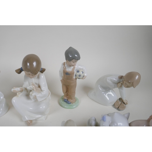 139 - A collection of fourteen Lladro and Nao figurines and animals, largest 22cm high