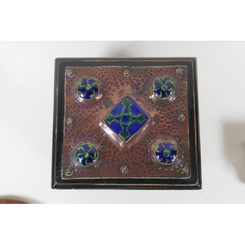 141 - An Arts & Crafts copper mounted ebonised wood card box with inset enamel panels, an Art Nouveau ... 