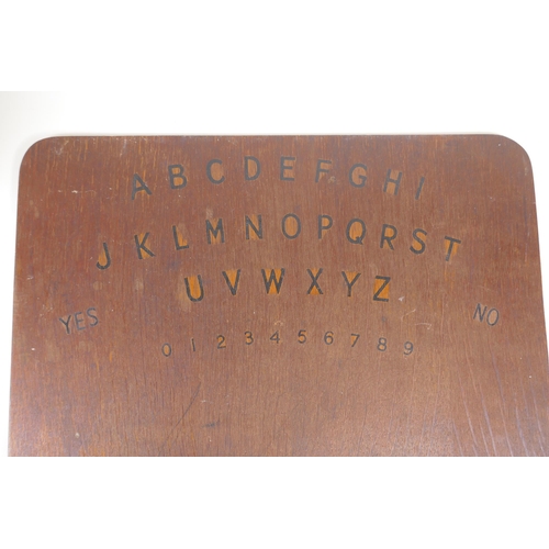 151 - A 1970s Gloy glue hand painted shop display stand, and a 70s hand made Ouija board, 41 x 37cm