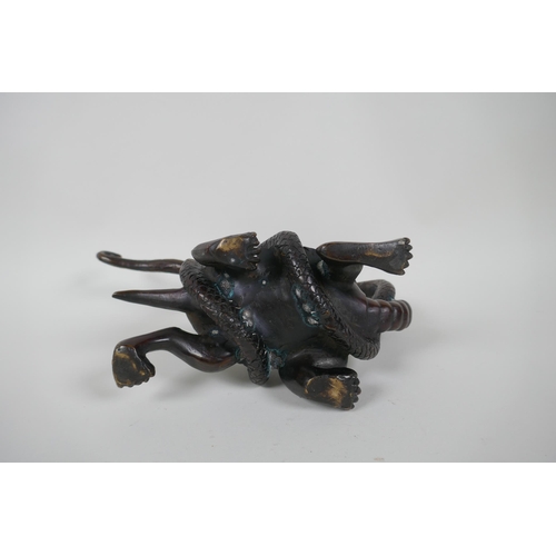 161 - A Chinese filled bronzed metal tortoise entwined with a snake, 26cm long, 17cm high