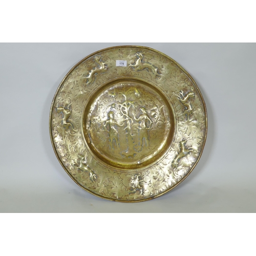 170 - A Nuremburg brass alms dish, the central field with a depiction of Adam and Eve with the Tree of Kno... 