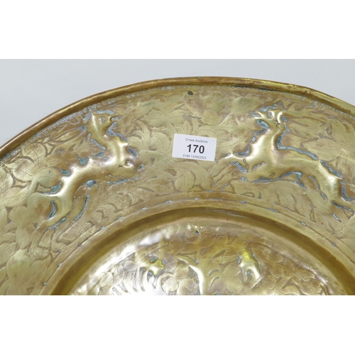 170 - A Nuremburg brass alms dish, the central field with a depiction of Adam and Eve with the Tree of Kno... 